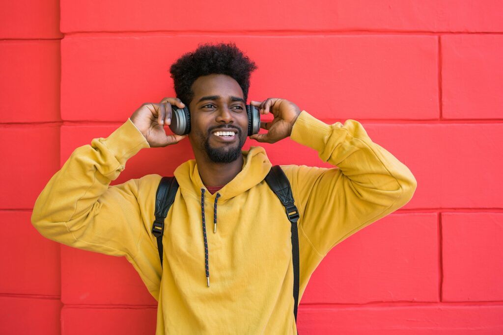 young-afro-man-listening-to-music-with-headphones-